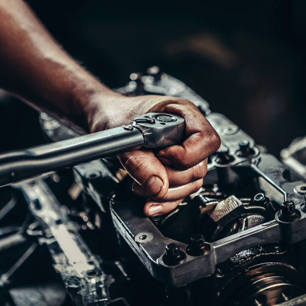 mechanic working on engine